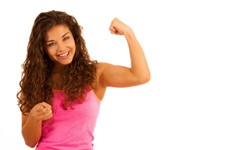 Active young sporty fit woman gesture power with her arms up isolated over whiteの写真素材