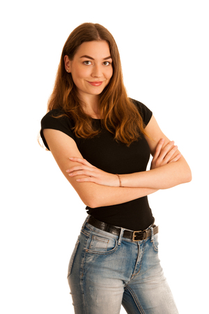attractive young woman in jeans and black t shirt isolated over white backgroundの写真素材