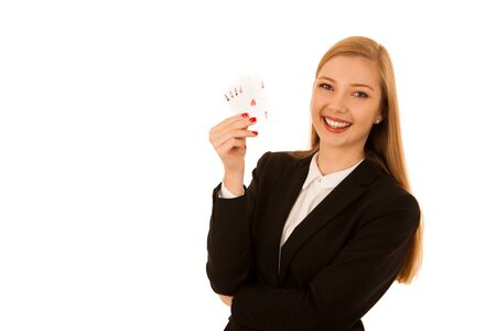 Beautiful woman showing for aces as a gesture of poger game - gambling in casino isolated over white...