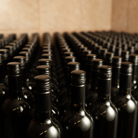 Bottles of wine in winecellar redy for packing and deliveryの写真素材