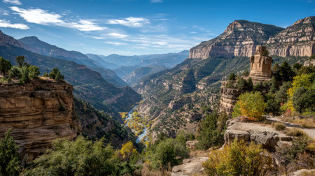 Rocky canyon with steep cliffs, a winding river below, and layered natural texturesの素材