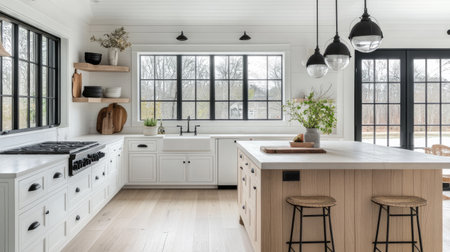 Bright farmhouse kitchen with light wood floors, white cabinetry, black fixtures, and a mix of modern and vintage accessoriesの素材