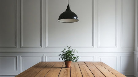 Serene Nordic-style dining area with white-painted walls, sleek wooden table, and a small potted plant centerpieceの素材