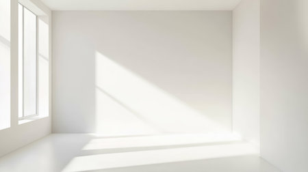 Clean white wall corner background with soft architectural light contrastの素材