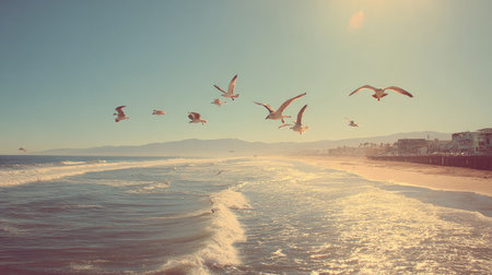 A tranquil coastal scene featuring seagulls soaring above gentle waves at sunset, creating a beautiful, serene atmosphere ideal for relaxation and escape.の素材