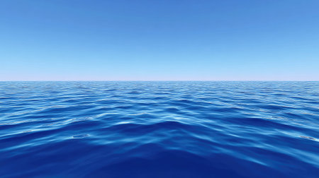 This serene image captures a vast blue ocean under a clear sky, highlighting gentle waves that create a calm and peaceful atmosphere. The endless horizon invites relaxation and a sense of freedom, perfect for travel and nature themes.の素材