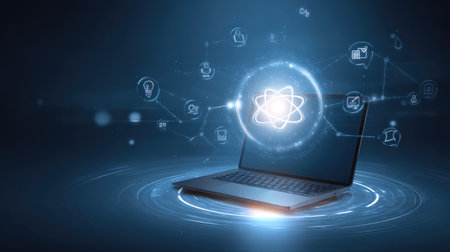 A futuristic laptop showcases a glowing digital atom model surrounded by connected icons, emphasizing technology, science, and innovation concepts in a modern design.の素材
