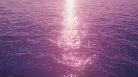 A stunning view of a pink ocean surface reflecting sunlight at sunset, creating a tranquil and serene atmosphere perfect for relaxation and inspiration.の素材