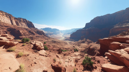 This stunning panoramic view showcases a vast desert canyon under a bright blue sky. The vibrant colors and unique rock formations create a picturesque desert landscape perfect for adventure and exploration.の素材