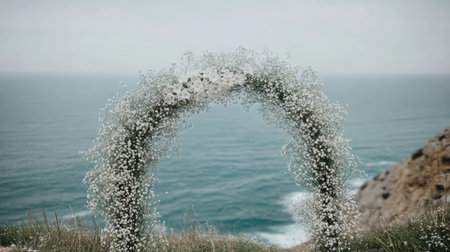 This enchanting floral archway adorned with delicate white flowers sits gracefully above calming ocean waves, providing a dreamy backdrop for romantic occasions.の素材