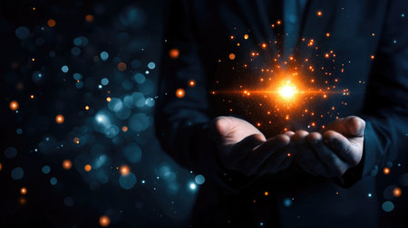 A pair of hands gently holds a glowing light against a dark background, creating a stunning visual of energy and hope, symbolizing inspiration and creativity.の素材
