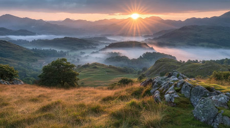 Experience the breathtaking beauty of a sunrise illuminating misty mountains. This serene landscape captures the tranquil essence of nature, showcasing rolling hills and vibrant skies.の素材