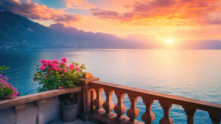 A captivating sunset casts vibrant colors over a tranquil lake, framed by blooming flowers on a charming balcony. Experience serene beauty in nature.の素材