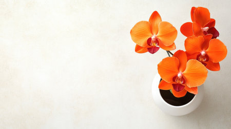 A stunning arrangement of bright orange orchid flowers in a simple white vase against a light background, showcasing natural beauty and elegance.の素材