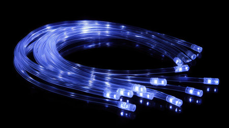 A vivid display of blue LED lights shining along flexible fiber optic cables. This artistic representation captures a modern glow with an ethereal quality, perfect for various design projects.の素材