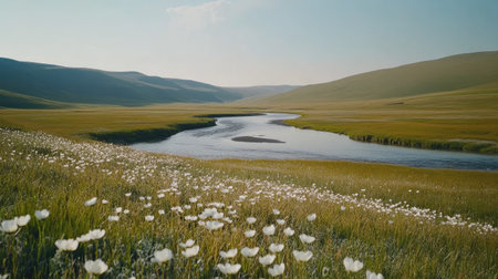 This breathtaking landscape features a winding river surrounded by lush meadows filled with blooming flowers, offering a peaceful escape into nature's beauty.の素材