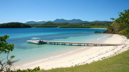 Enjoy a stunning tropical beach scene featuring a wooden pier, a boat, and clear blue water, surrounded by lush greenery and distant mountains.の素材