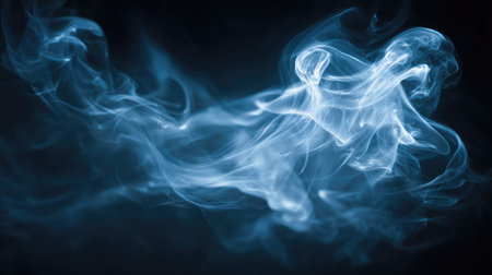 This captivating image features ethereal blue smoke gracefully swirling against a dark background, creating mesmerizing patterns perfect for artistic and abstract projects.の素材