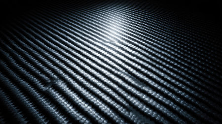 Explore this intricate textured background featuring reflective patterns in shades of black and grey, perfect for modern design projects and artistic inspiration.の素材