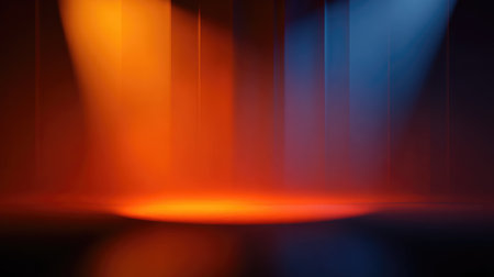 A captivating image showcasing vibrant stage lighting with dynamic orange and blue beams illuminating a darkened backdrop, perfect for performance or event design.の素材