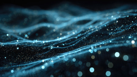 This abstract image features dynamic digital waves illuminated by blue particles, creating a captivating visual effect that embodies technology and innovation.の素材
