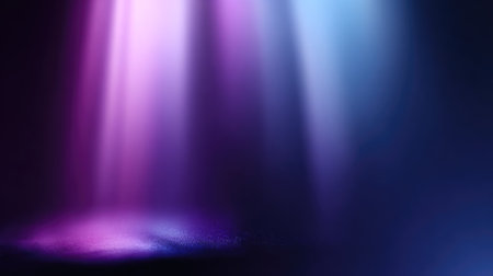 This image features soft light rays in purple and blue hues creating a serene and dreamy atmosphere against a dark backdrop, perfect for artistic projects.の素材