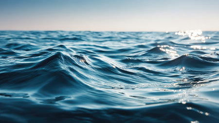 Explore the captivating beauty of gentle ocean waves under a soft blue sky at dusk, ideal for evoking tranquility and serenity in various art and design projects.の素材