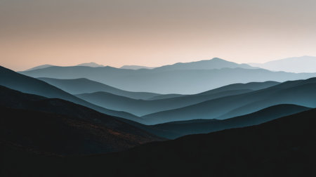 Experience a captivating view of layered mountains at dusk, showcasing serene hues and soft gradients that inspire tranquility and appreciation for nature's beauty.の素材