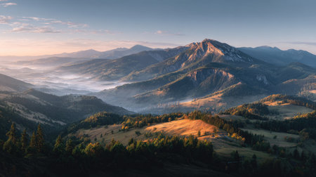 Experience the beauty of a serene morning in nature, featuring misty valleys and majestic mountains bathed in soft sunrise light, perfect for outdoor lovers.の素材