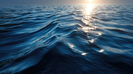 Experience the calm beauty of ocean waves at sunrise, highlighting the interplay of light and water. Ideal for promoting tranquility and nature themes.の素材