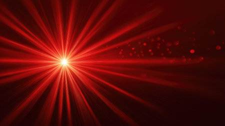 This vibrant red light burst features dynamic rays and glowing particles, creating an impressive abstract background perfect for art, design, or festive themes.の素材