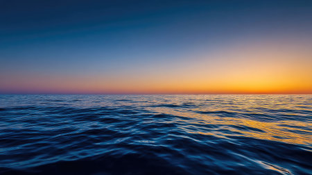 A breathtaking view of a serene ocean at sunset, featuring gentle waves and a colorful sky creating a tranquil atmosphere perfect for relaxation and nature appreciation.の素材