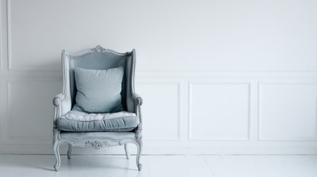 This image features a vintage armchair with a soft blue cushion placed against a bright white wall, creating a serene and elegant atmosphere perfect for interior design inspiration.の素材