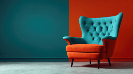 A striking modern armchair featuring a vibrant blue backrest and an orange seat, set against a two-tone wall, perfect for adding style to contemporary interiors.の素材