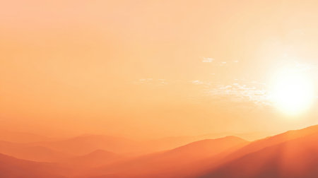 Experience the serene beauty of a soft golden sunrise illuminating a distant mountainous landscape, perfect for creating a peaceful and inspiring ambiance.の素材