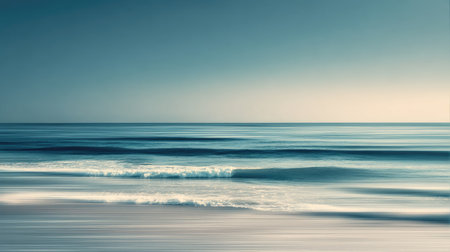 A serene seascape capturing gentle waves and soft colors during sunrise, creating an atmosphere of tranquility and beauty in nature's vast expanse.の素材