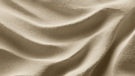 This soothing beige sand texture features gentle waves and subtle patterns, perfect for backgrounds in design projects, art, or photography. Its warm tones add elegance.の素材