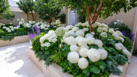 A beautifully arranged garden with lush white hydrangeas, vibrant greenery, and delicate purple flowers creates a serene outdoor space ideal for relaxation and aesthetic enjoyment.の素材