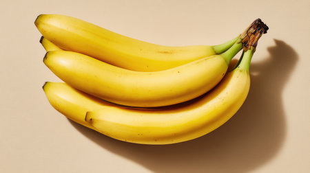 A vibrant display of fresh bananas arranged on a neutral backdrop, ideal for food photography and healthy eating concepts, showcasing their natural color and appeal.の素材