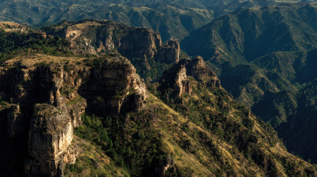 Breathtaking view of rugged mountains and valleys bathed in sunlight, capturing the raw beauty and tranquility of nature's majestic landscapes. Perfect for outdoor enthusiasts.の素材