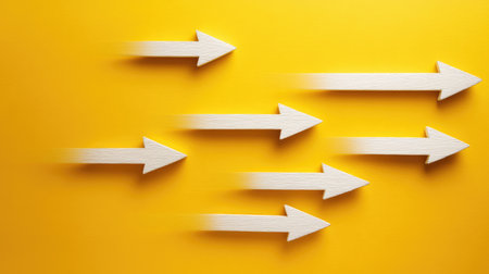 This vibrant image features dynamic white arrows in motion against a bright yellow background, symbolizing direction, speed, and progress in a creative and modern context.の素材