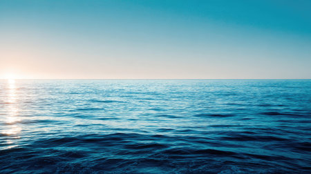Experience the tranquil beauty of a serene ocean horizon at sunset. The calm waters reflect soft light and create a peaceful atmosphere perfect for relaxation.の素材