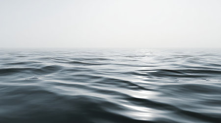 This image captures the tranquil beauty of calm ocean waves at dusk, with soft reflections creating a serene atmosphere that invites relaxation and contemplation.の素材