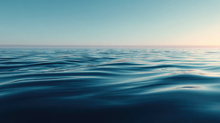A picturesque view of the ocean showcasing gentle waves under a soft blue sky. The tranquil scene evokes feelings of peace, ideal for nature enthusiasts and travel.の素材