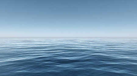 Explore the serene beauty of a calm ocean water surface reflecting a clear sky. This tranquil seascape captures the essence of peace and relaxation ideal for various projects.の素材