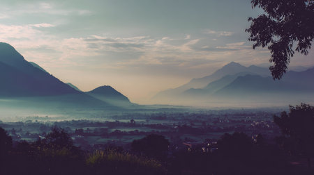 A breathtaking morning scene showcasing misty mountains and valleys under a calm sky at dawn, ideal for evoking serenity and natural beauty in various contexts.の素材