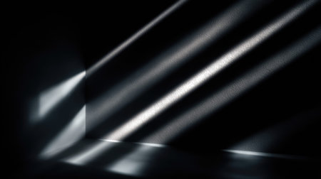 Abstract composition featuring striking light rays entering a dark space, creating a captivating interplay of shadows and illumination, perfect for artistic exploration.の素材
