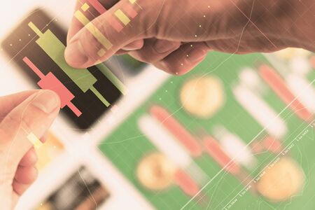 Hands holding Candlestick chart make from color paper white and red, investment, trading, stock,...