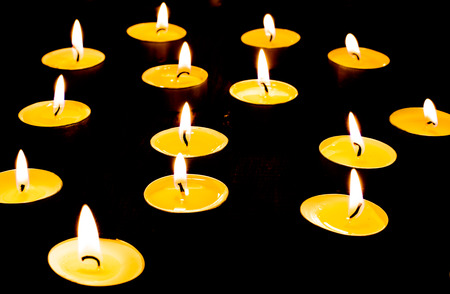 Romantic time with candle of light on dark backgroundの写真素材