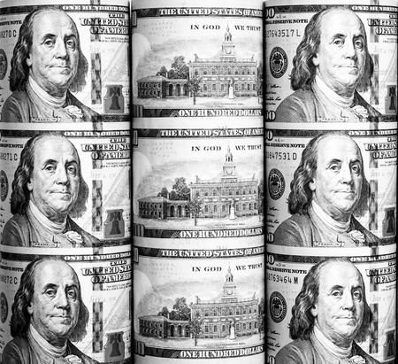 Roll background of hundred  dollars notes with black and white color